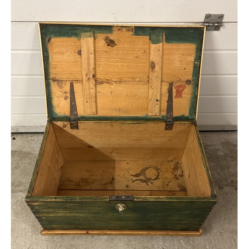 1390 - A small vintage pine box with green painted detail. With hinged lid and with drop handles on ends. A... 