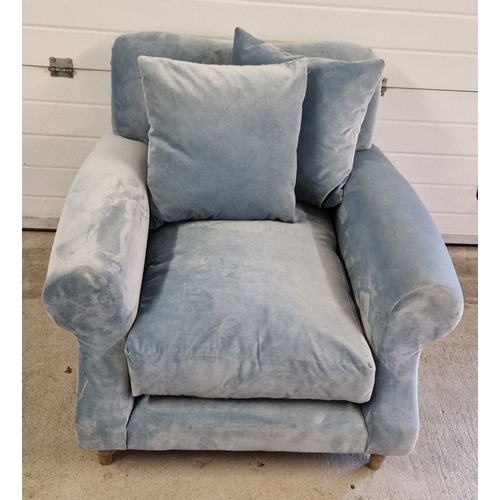 1391 - A modern low armchair with light blue velvet upholstery, wooden feet and 2 additional cushions. With... 