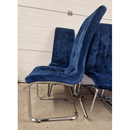 1396 - A set of 8 modern dining chairs with blue velvet upholstery and chrome hooped legs. Each approx. 102... 