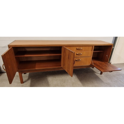 1398 - A vintage mid century G Plan teak sideboard with hooped wooden handles. Baize lined cutlery drawer, ... 