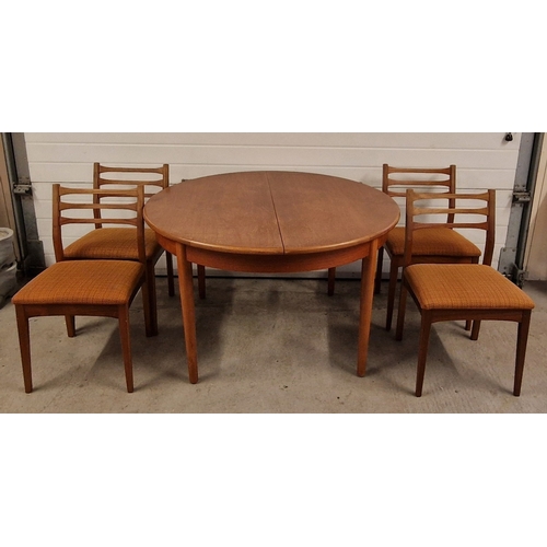 1401 - A vintage mid century teak dining table and 4 chairs with woven fabric upholstered seats. Circular s... 