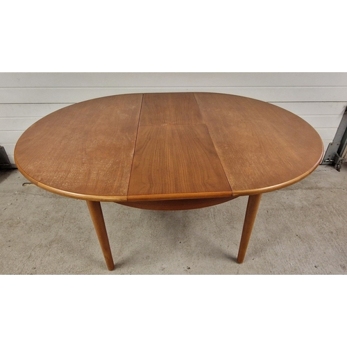 1401 - A vintage mid century teak dining table and 4 chairs with woven fabric upholstered seats. Circular s... 