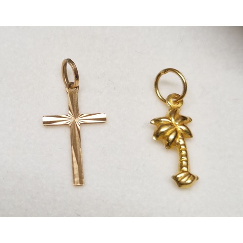 170 - 2 x 9ct gold charms/pendants, a palm tree and a cross with sun ray decoration. Hallmarked on bale of... 