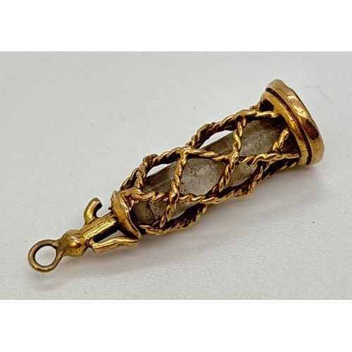 15 - A vintage 9ct gold and glass charm in the shape of a soda siphon. Gold marks on rim of base. Approx.... 