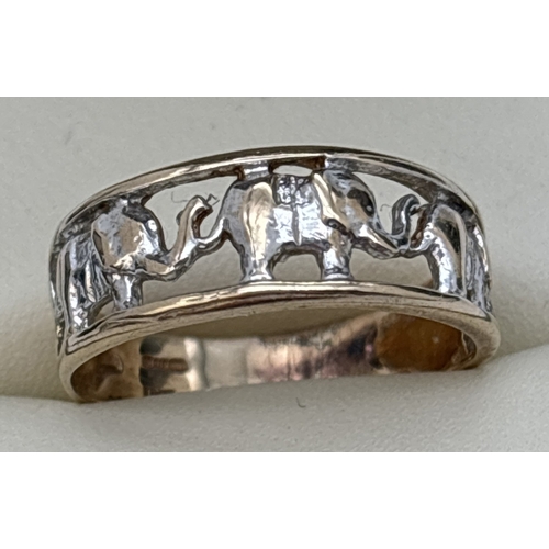 19 - A 9ct white and yellow gold elephant design band ring with pierced work detail. Gold marks inside ba... 