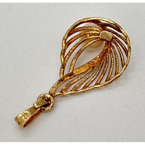 100 - A 9ct gold teardrop style pendant with openwork detail and set with single pearl. Gold mark to back ... 