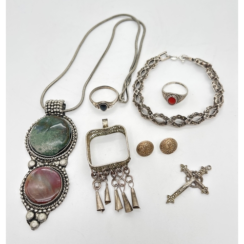 1057 - A small collection of vintage white metal jewellery to include ethnic style. Includes a double natur... 