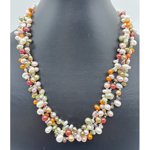 1078 - A 3 strand multi coloured freshwater pearl and peridot chip necklace with large white metal spring r... 