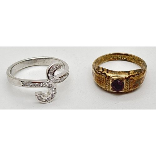 1142 - 2 boxed silver rings. A modern twist design ring set with clear crystals and a vintage silver gilt r... 