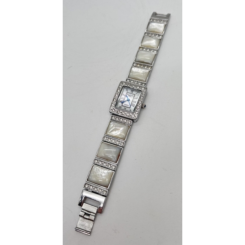 1155 - A boxed mother of pearl and crystal ladies quartz wristwatch from the Marcel Drucker collection. Squ... 