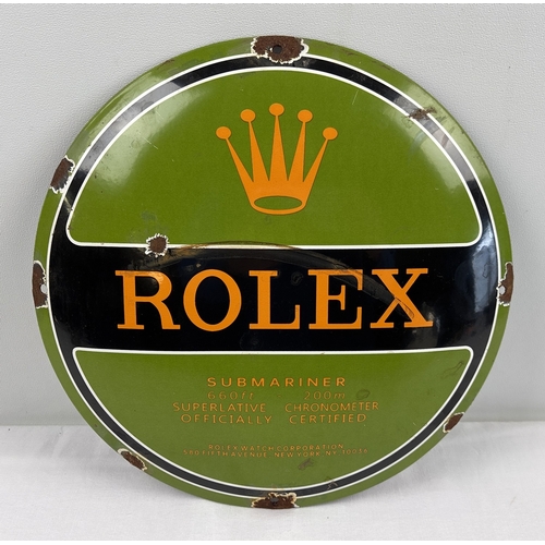 1196 - A circular shaped Rolex convex shaped enamelled metal wall advertising sign. In green, orange & blac... 