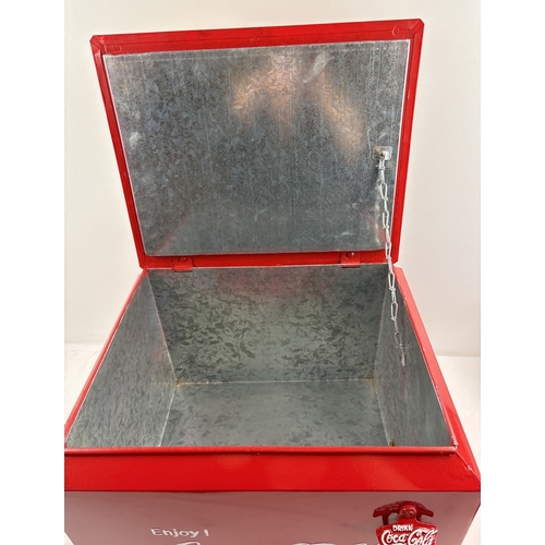 1202 - A modern painted metal 2 handled Coca Cola advertising cool box with lift up lid and bottle opener. ... 