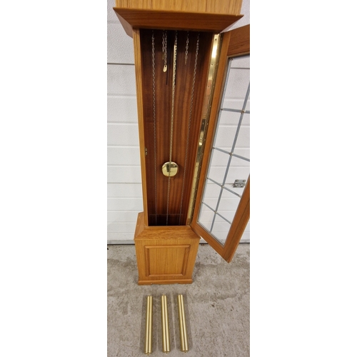 1211 - A mid century light wood Tempus Fugit West Germany long cased clock with leaded glass body. With gol... 