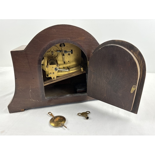 1213 - An Art Deco wooden cased mantle clock with Westminster chime, in working order. Inlaid detail to ven... 