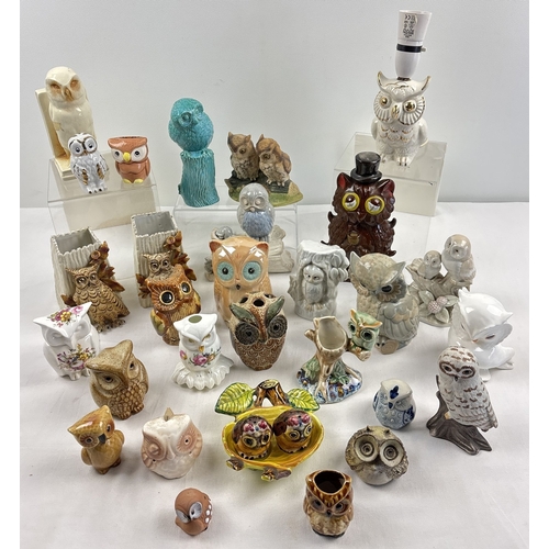 1235 - A collection of 29 assorted ceramic owl figures to include cruet, table lamp, decanter, money box, v... 