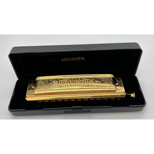 1270 - A cased Super 270 Chomonica Chromatic Harmonica by Hohner in a gold tone finish. In the key of C. En... 