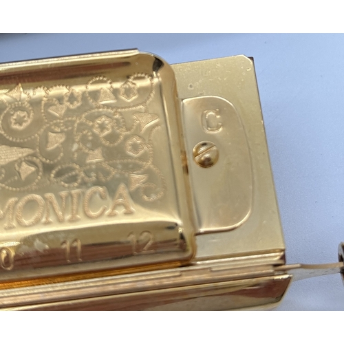 1270 - A cased Super 270 Chomonica Chromatic Harmonica by Hohner in a gold tone finish. In the key of C. En... 