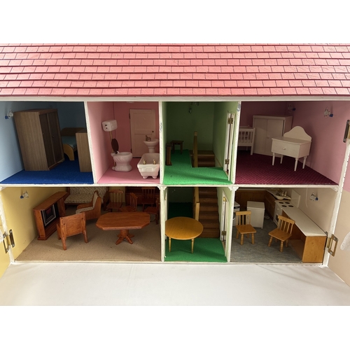 1281 - A large wooden fully furnished dolls house with red brick finish. Fully fitted with electrical light... 