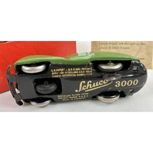 1293 - A Schuco boxed Vintage German tinplate Telesteering remote control Fernlenk-Auto 3000 car in green. ... 