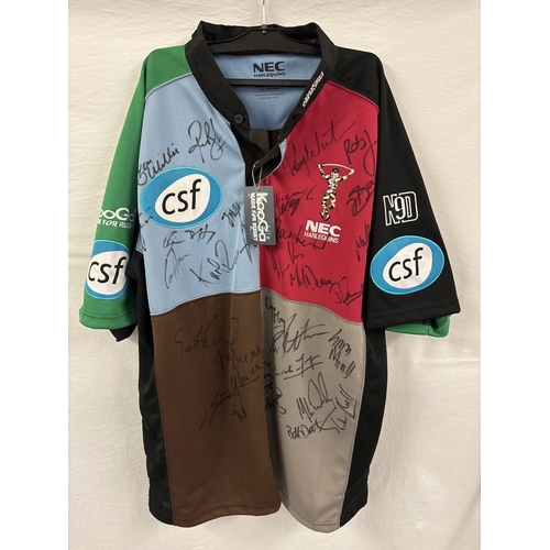 A signed Kooga NEC Harlequins Rugby Home Shirt, 2003/4 season. Size L, unworn with original tag. With 30 signatures to include Andre Vos, Roy Winters, Ugo Monye, Andy Reay and Henry Barrett.