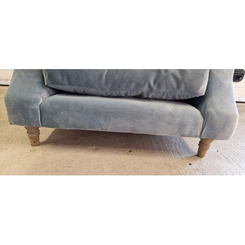 1391 - A modern low armchair with light blue velvet upholstery, wooden feet and 2 additional cushions. With... 