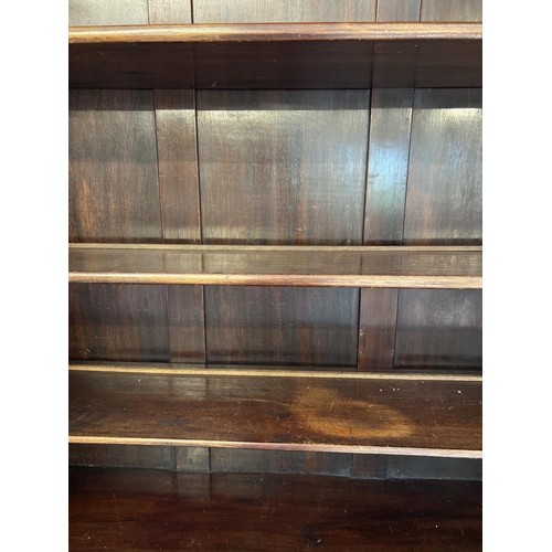 1398 - An early 20th century dark wood bureau bookcase raised on 4 ball & claw feet. 2 door glazed bookcase... 