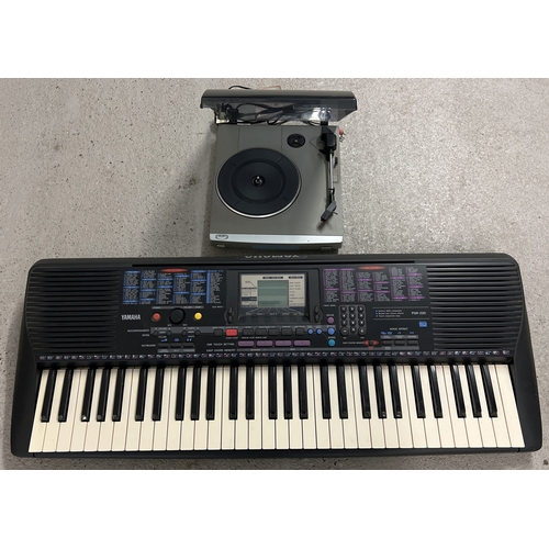 1275 - A Yamaha PSR-220 electronic keyboard together with a Bush Acoustics mini turntable.