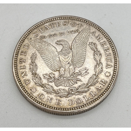 1 - An American 1921 silver Morgan dollar coin with mint mark for Denver. Lady Liberty to obverse, desig... 