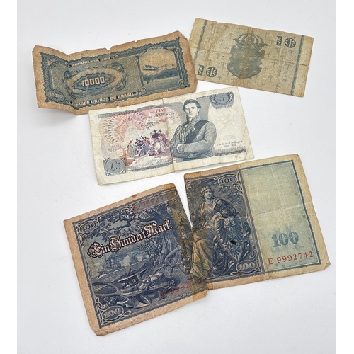 2 - 4 vintage British and foreign bank notes. A Duke Of Wellington £5 note (30J 564004), a 10 Kronor not... 