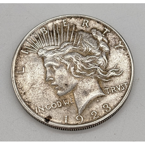 12 - A 1923 silver American Morgan 