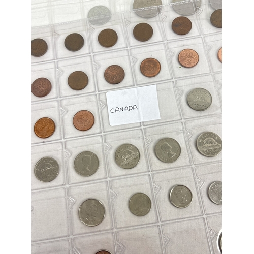 13 - A collection of assorted 20th century foreign coins in 5 clear plastic display sleeves. Contains coi... 