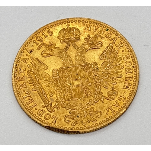 15 - A 1915 restrike 23ct gold Austrian 1 Dulcat coin featuring Emperor Franz Joseph I to obverse & Austr... 