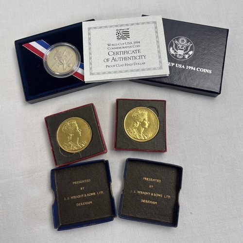 17 - 3 boxed commemorative coins and medallions. A United States Mint proof clad World Cup USA 1994 Comme... 