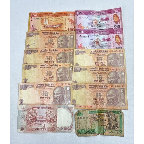 21 - 12 vintage Indian and Sri Lankan bank notes. Indian 10, 20 and 100 rupee notes together with Sri Lan... 