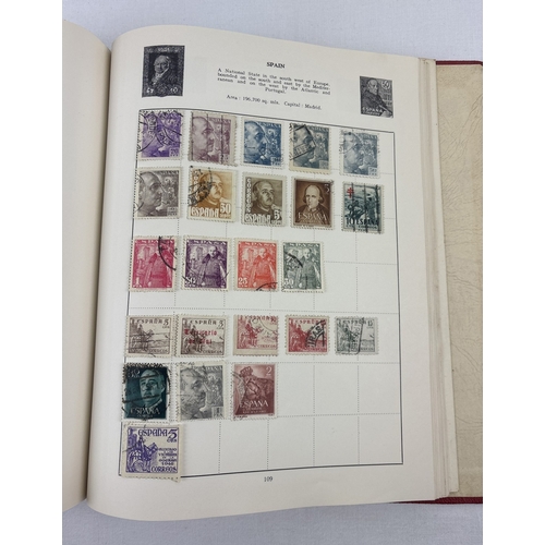 40 - A vintage 1930's Liberty postage stamp album & slip cover containing assorted world stamps.