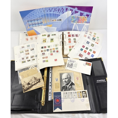 42 - A vintage lever arch file containing assorted world stamps, together with an Australia Post 2000 Oly... 