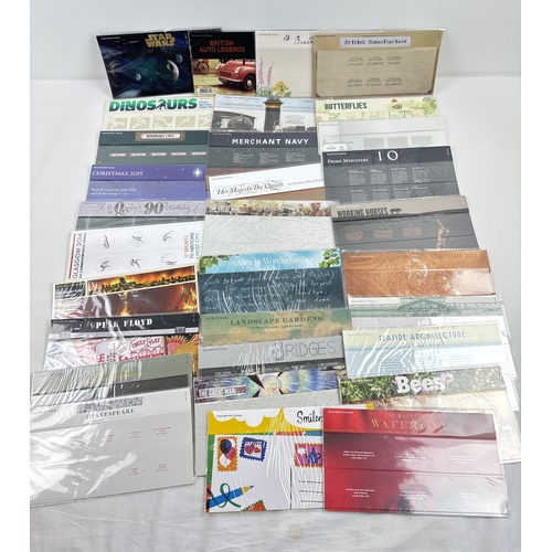 43 - 31 empty Royal Mail collectors stamp presentation packs. To include Star Wars, Beatrix Potter, auto ... 