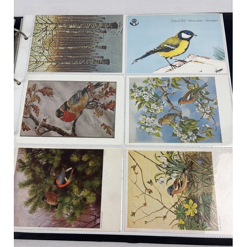 69 - 2 large albums containing 400+ modern bird & wildlife postcards together with a collection of 200+ v... 