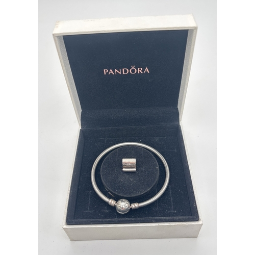 1111 - A boxed 17cm charm bangle by Pandora with classic ball clasp. Comes with a Best Friends scroll charm... 