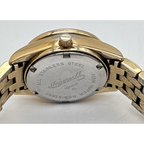 1203 - A ladies Ingersol Gems wristwatch IG0015 with 18ct gold plated case and bracelet strap. White and bl... 