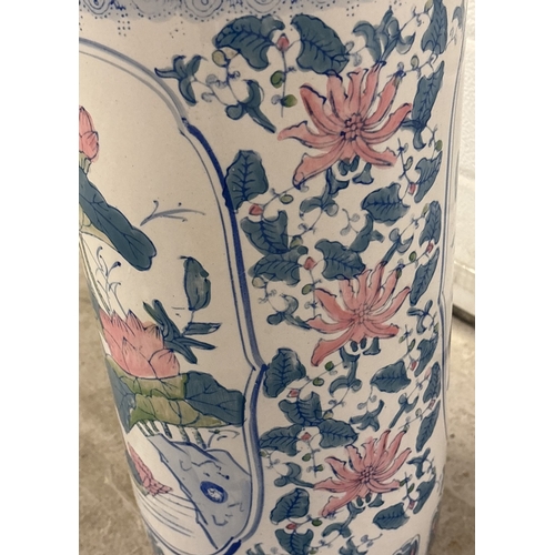 1280 - A large Chinese style ceramic umbrella/stick stand of floral design. Approx. 47cm tall x 22cm diamet... 