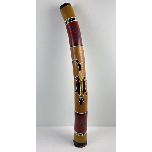 1342 - An Australian didgeridoo made from bamboo with hand painted lizard and indigenous decoration through... 