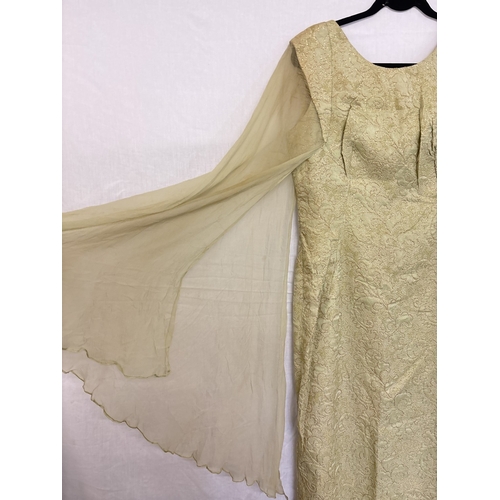 1402 - A 1960's long pale green and gold evening dress with long floating chiffon angel style sleeves by Ro... 