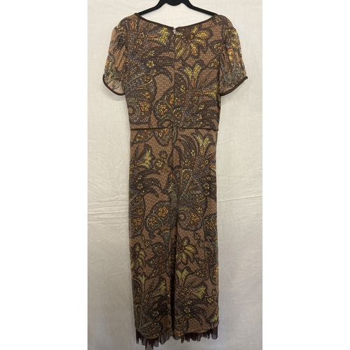 1404 - A vintage 1970's short sleeve 2 layer maxi dress in brown floral polyester. Cut out detail to oversk... 