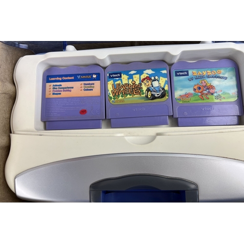 3 - A boxed Vtech V.Smile Motion Active Learning System complete with 9 games, wireless controller & use... 