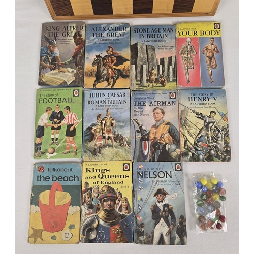 52 - A box of assorted vintage toys and books to include 11 Ladybirds books dating from the late 1950's t... 