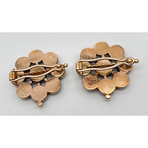 1005 - 2 vintage rose gold garnet set flower design hairclips. Central round cut garnet surrounded by 8 rou... 