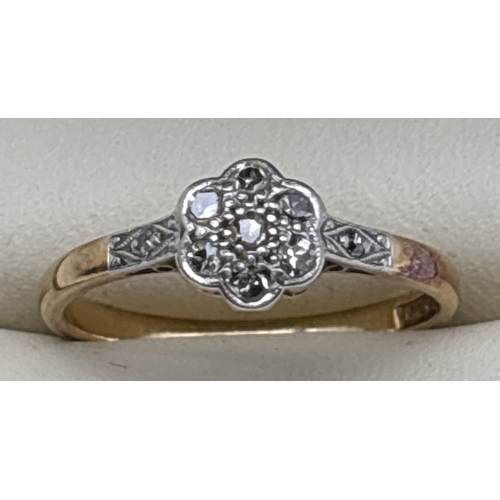 1012 - An Art Deco 18ct gold and platinum, diamond set ring with flower head design. Central mount set with... 