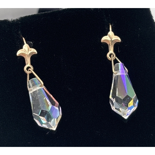 1032 - 2 pairs of vintage yellow metal crystal set drop earrings. A pair of Aurora borealis drops with fleu... 