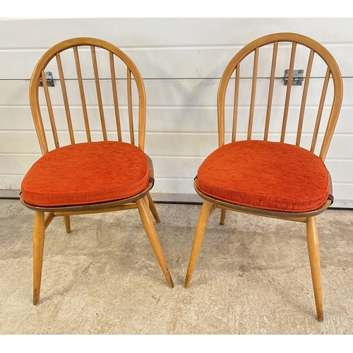 1430 - 2 vintage elm wood Windsor dinning chairs by Ercol, both with rust upholstered seat pads. Blue label... 